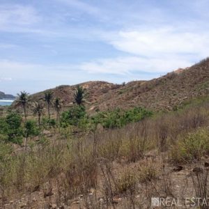 Panoramic hilltop land with ocean view for sale in Lombok.